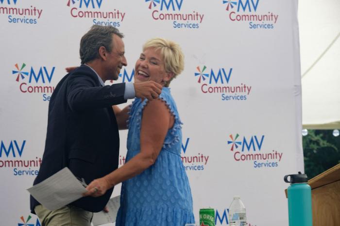 Seth Meyers and community services executive director Beth Folcarelli.
