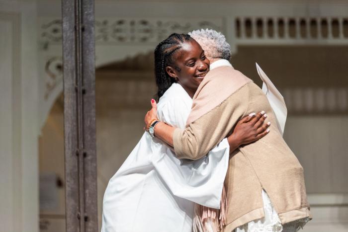 Shantavia Wiley (left) hugs Toni Kauffman, president of the Martha's Vineyard chapter of the NAACP>