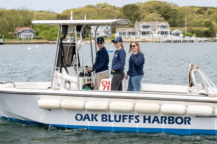 Emily deBettencourt, assistant harbor master Maeve Rice and office manager Jennifer Goeckel take a spin in the harbor master's boat.