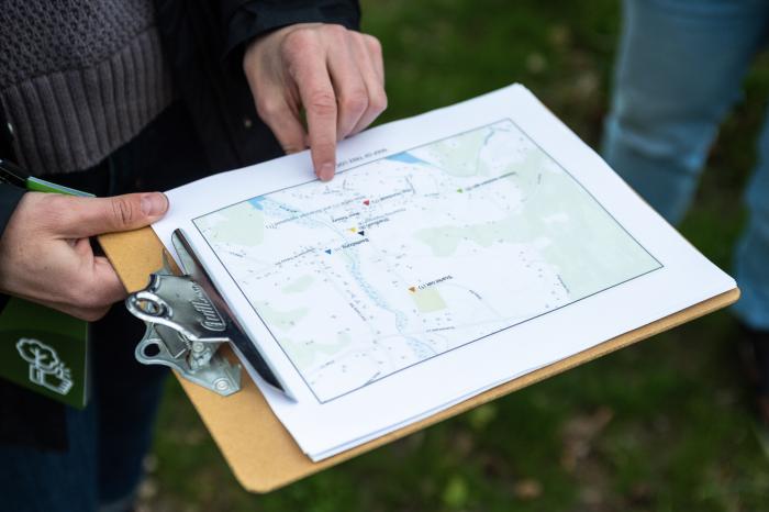 Tree committee member Emily Ellingson points out new tree planting locations around West Tisbury.