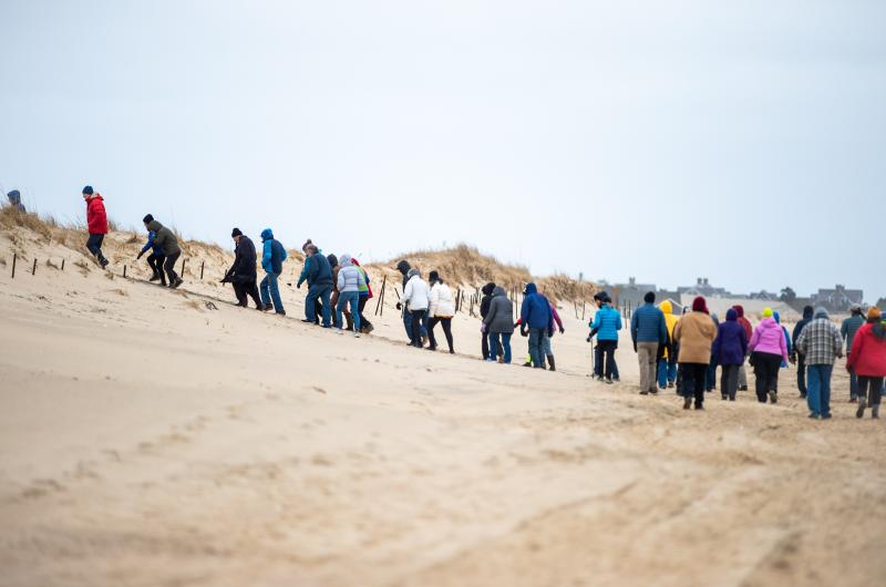 Marching back up the dunes.