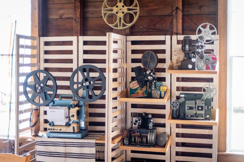 Collection of projectors and film-making gear.