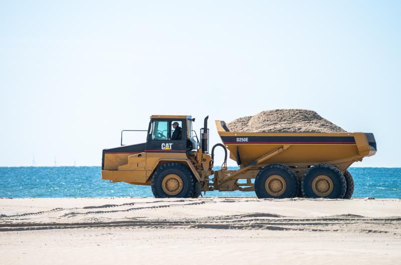 Heading down the beach with a fresh load of sand.
