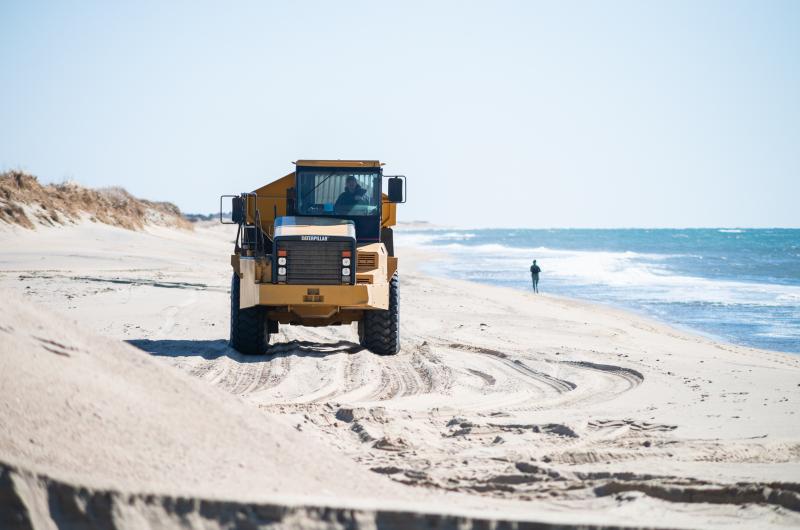 Truck returning from South Beach to pick up more sand.