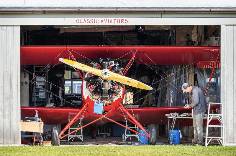 Mike Creato gets the iconic red biplane ready to fly.