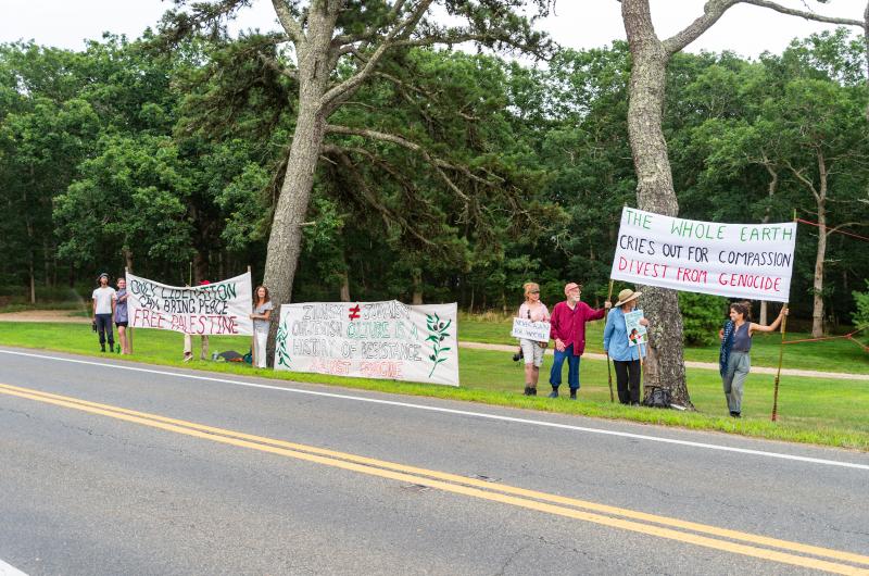 A small group of protestors gathered on the other side of the road.
