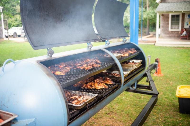 Tyler Potter of The Swimming Pig making barbecue.