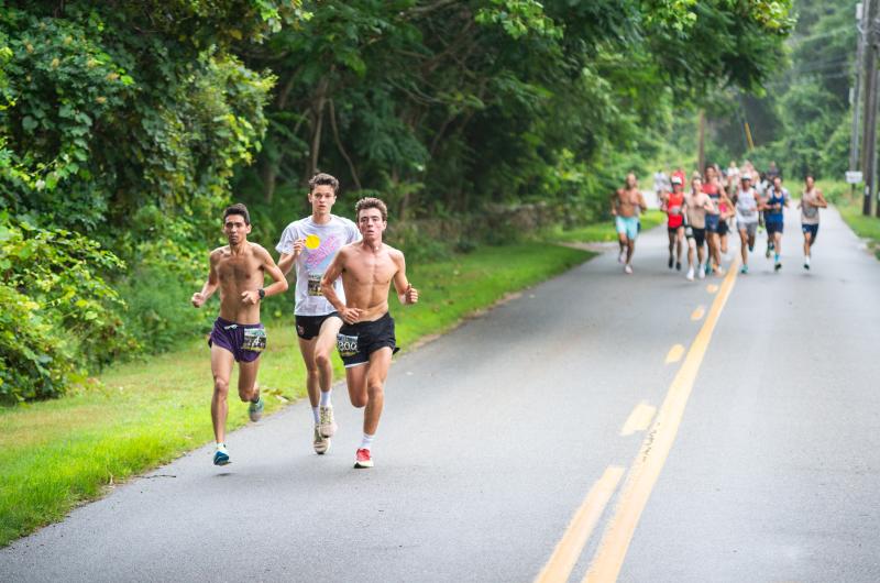[l-r] Michael Schroeder, Charlie Ortmans, and Jack Lionette take off from the pack.