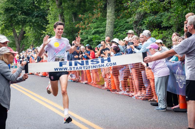 Charlie Ortmans crosses the line.