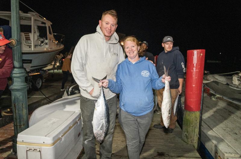 Breck and Desiree Holdredge weighing in fish in Edgartown.