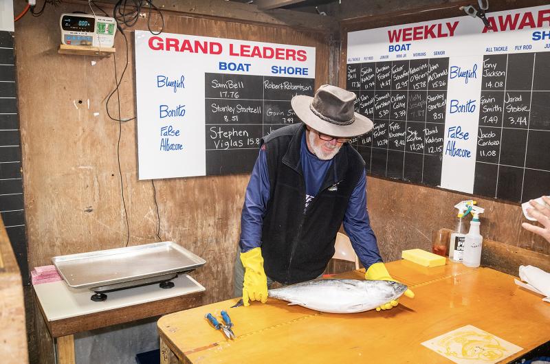 Mike Cassidy occupying his usual position as weigh-master.