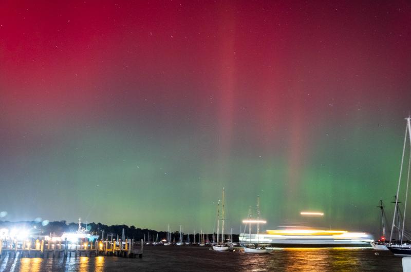 Steamship ferry entering under the Aurora Borealis.
