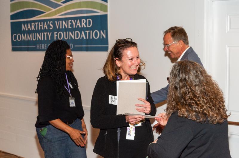 Leah Palmer of CAP receives a grant.