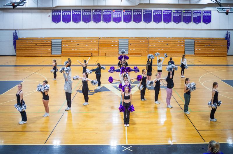Dancers come together to form a star.