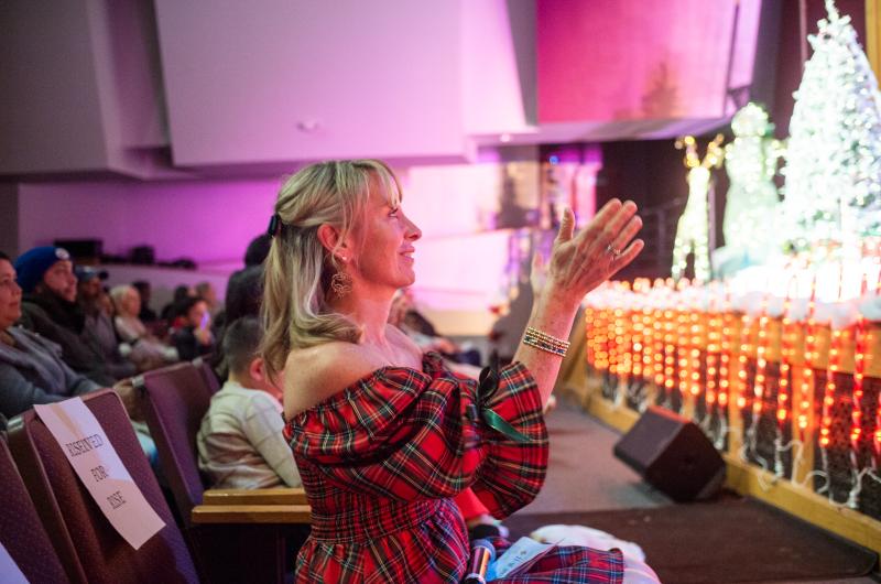 RISE director Jil Matrisciano applauds her students work.