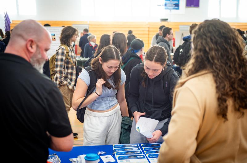 Students speak with members of Rockland Trust bank.