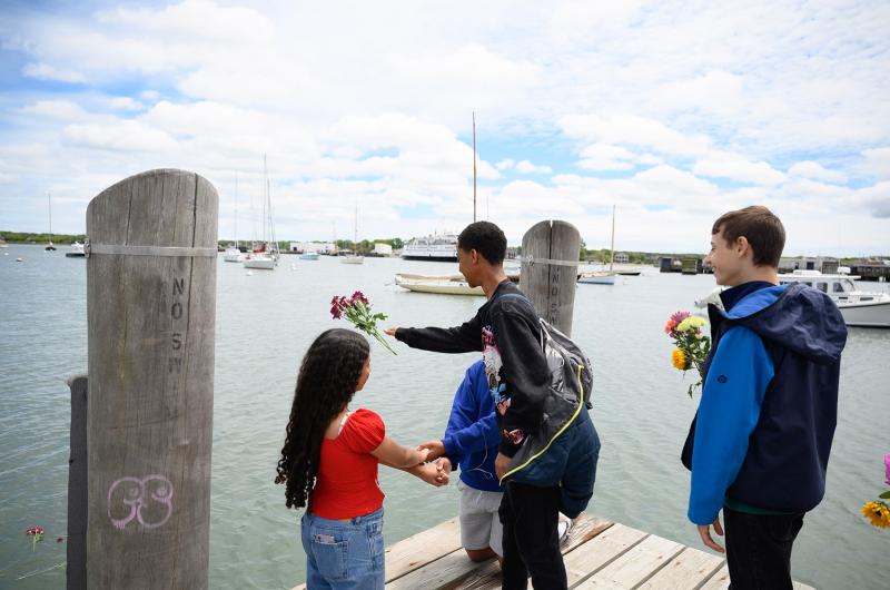 Throwing flowers into Vineyard Haven harbor.