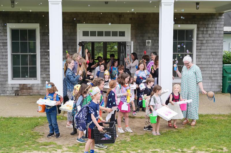 Chilmark school students spill out onto the lawn.