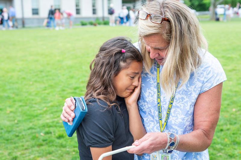 Brielle Cortez says goodbye to her teacher Anne Williamson who is retiring this year.