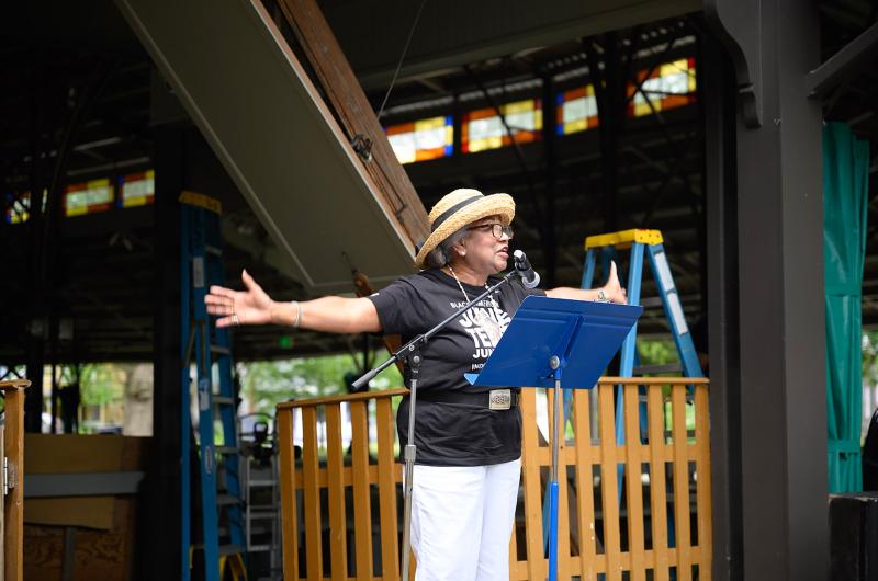 Dr. Lorna Andrade speaks to the crowd at the Juneteenth flag-raising at The Tabernacle.