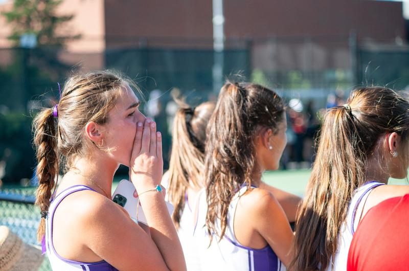 Cheering on the team.