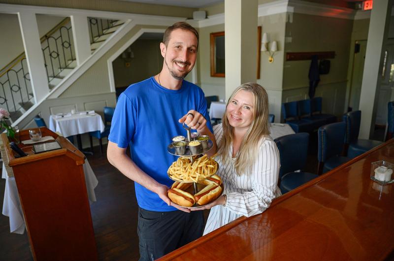 Chris and Marina Stam of Alchemy show off the famous hot dog tower.