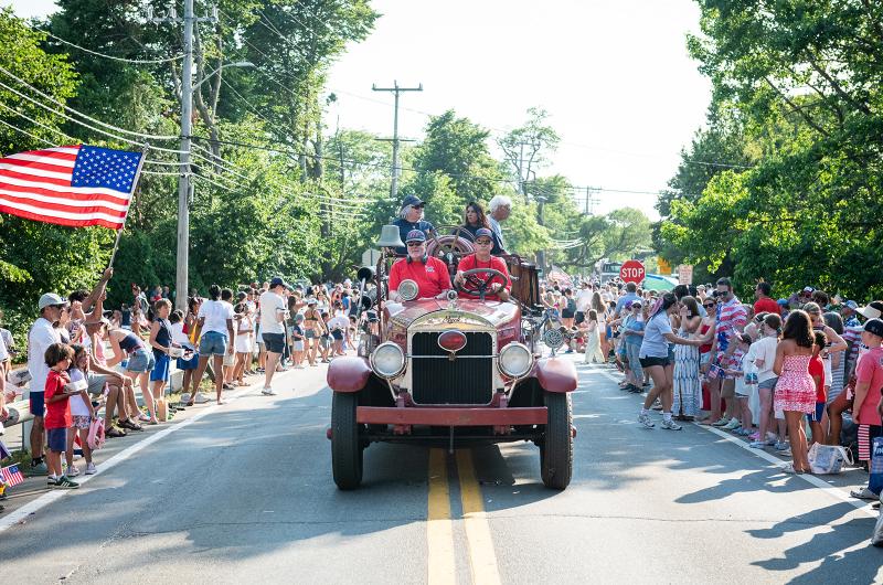 Scott Ellis drives the antique fire engine through town.