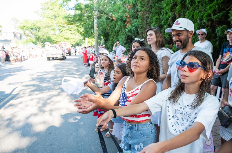 Catching candy from the floats is an Edgartown sport.