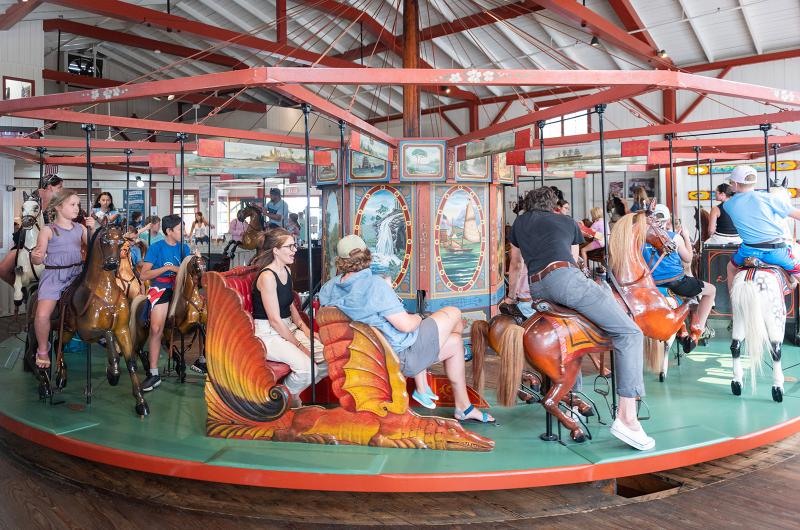 Riders of all ages enjoy the carousel.