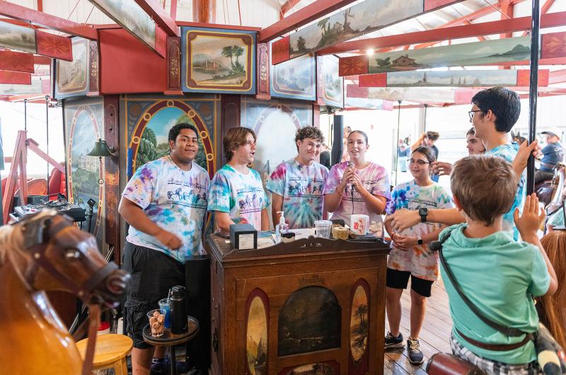 Flying Horses staff sing Happy Birthday to the carousel.