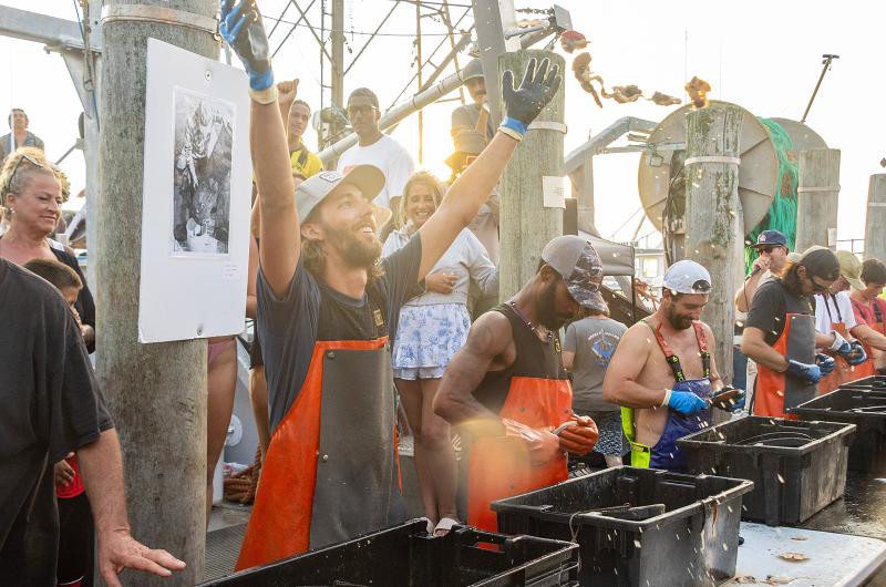 Otto Osmers wins the annual scallop shucking competition.