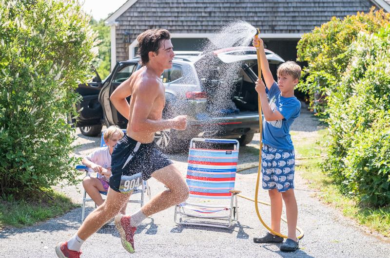 A welcome shower from a garde hose.