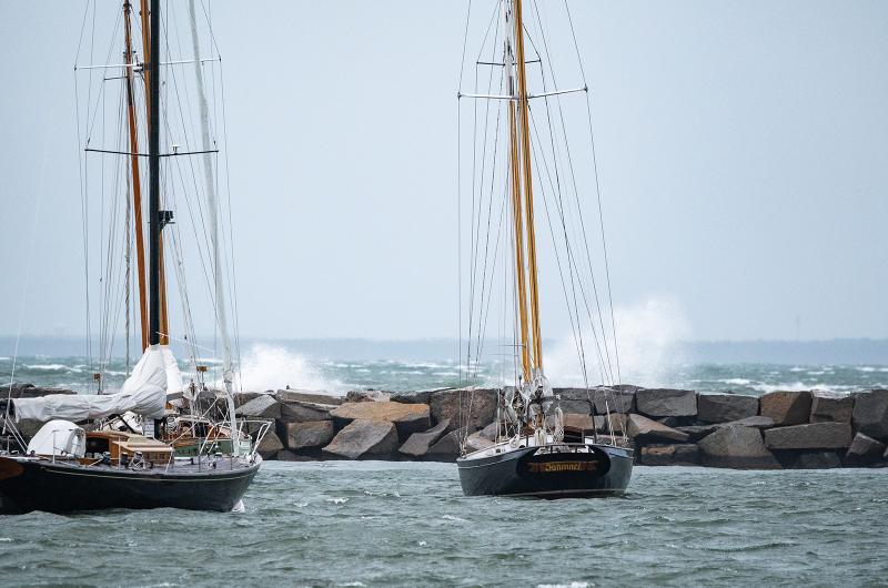 Big waves crash over the Vineyard Haven harbor breakwater.